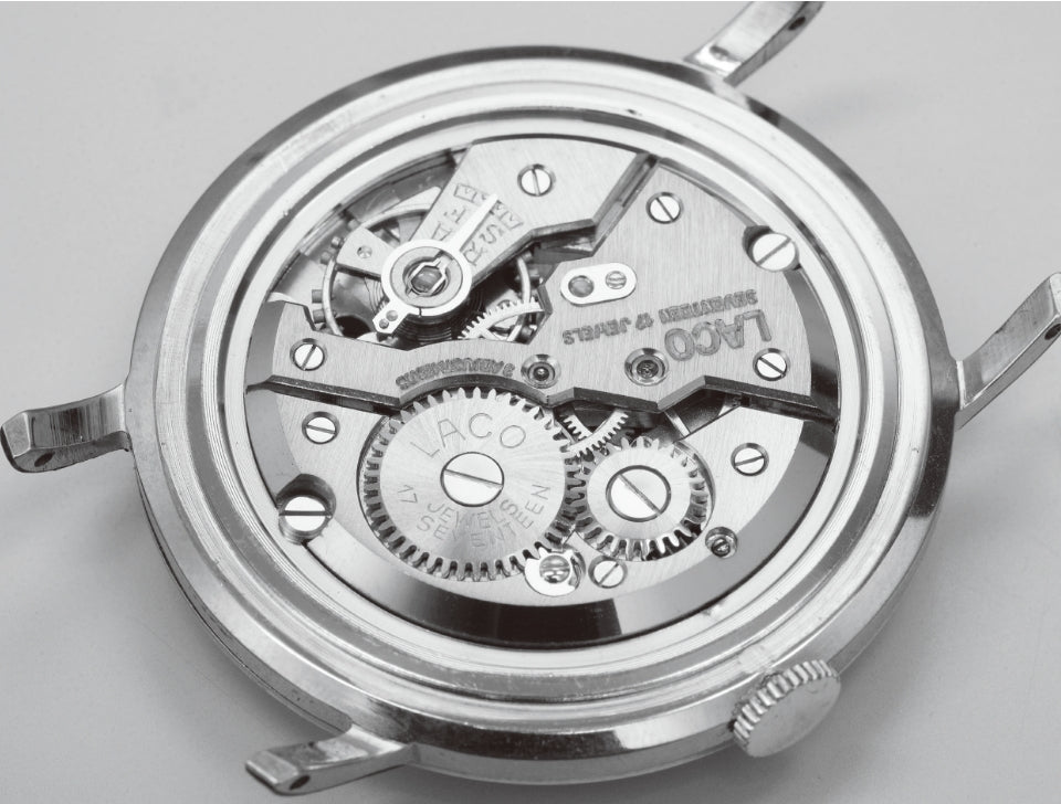 タカノ初の腕時計「Laco」この個体はステンレス製のケースに金張りのベゼルが付いていた。